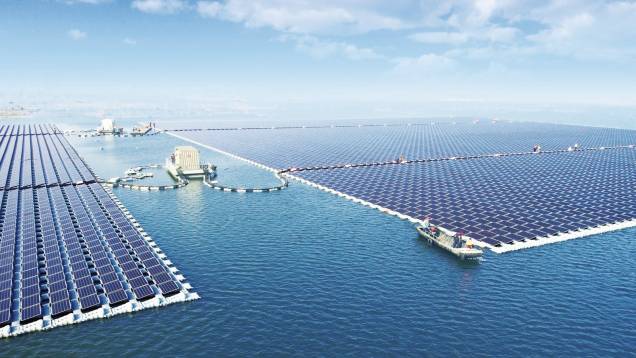 Massive floating solar farm on a body of water, showcasing renewable energy infrastructure on water surfaces.